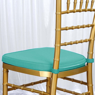 Gold chiavari chair with turquoise cushion, styled for events or weddings.