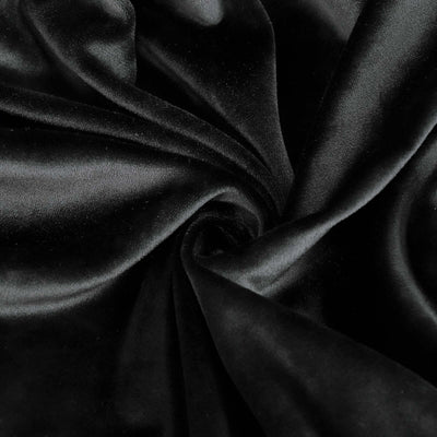 Black velvet fabric draped in soft folds, showcasing its rich texture and sheen.