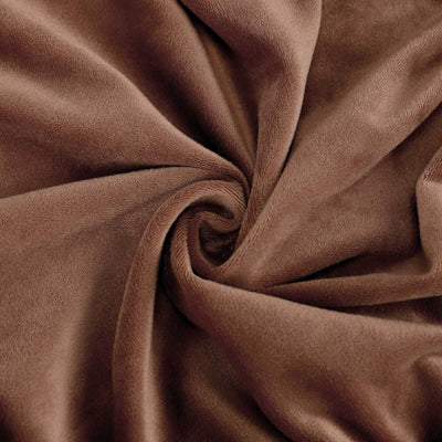 Soft brown fabric texture with a smooth, swirling pattern.