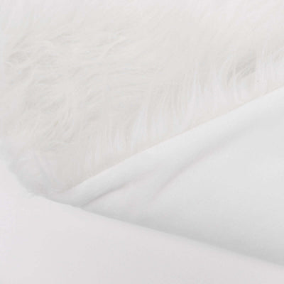 White faux fur and soft fabric texture background.