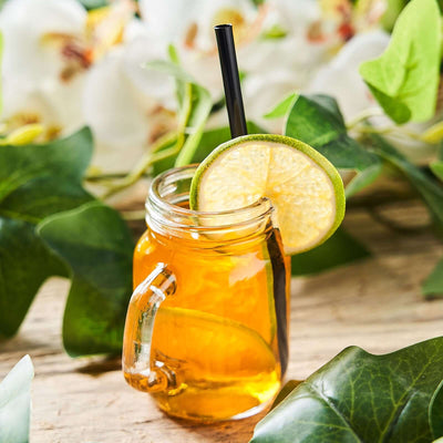 Refreshing iced tea with lemon garnish in a mason jar.