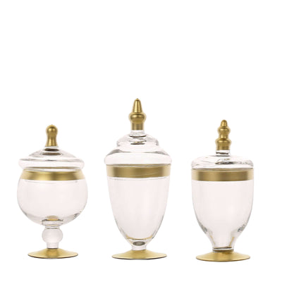 Set of three elegant glass jars with gold accents