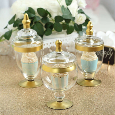 Decorative glass jars with gold accents and cupcake displays.