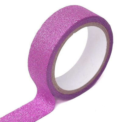 Pink glitter washi tape roll on a white background