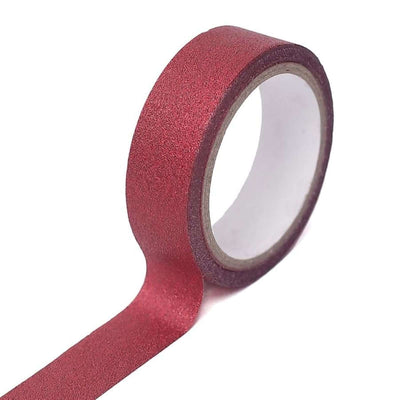 Red glitter washi tape roll on a white background