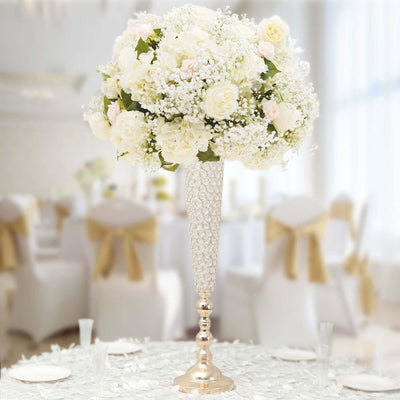 Elegant white floral centerpiece in a crystal vase for wedding decor.