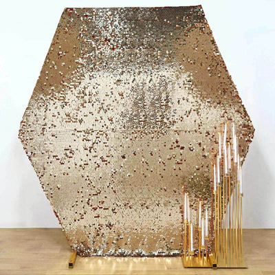 Gold sequin hexagon backdrop with elegant candle holders
