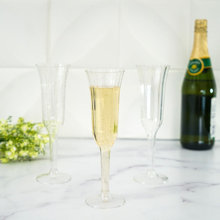 Disposable Clear Plastic Champagne Flutes With Flared Design 12 Pack 6 OZ Gold Glitter Sprinkled