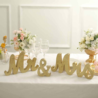 Gold glitter "Mr & Mrs" table decor for weddings and events.