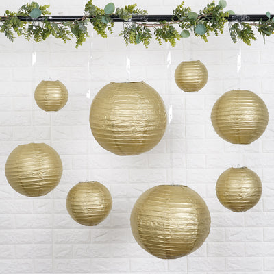 Gold paper lanterns hanging with greenery decoration