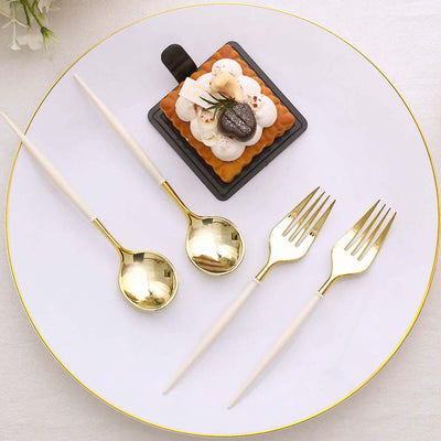 Elegant gold-accented cutlery set displayed with a dessert on a white plate.