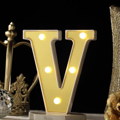 Illuminated letter "V" decorative light with LED bulbs.