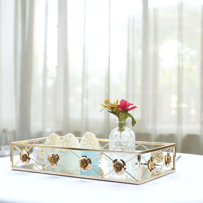 Decorative gold tray with flowers and dessert cups on a table.