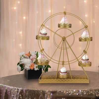Gold cupcake stand in the shape of a Ferris wheel with decorated cupcakes.