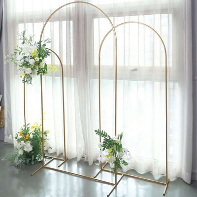 Gold metal arch with floral arrangements for decoration