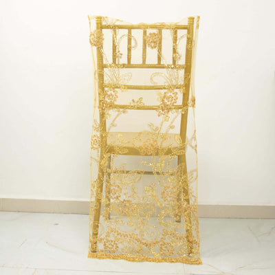 Gold embroidered chair cover with floral design.