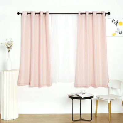 Pink sheer curtains hanging in a bright, modern living room setting.