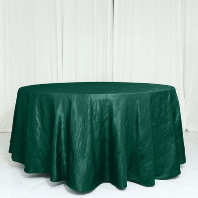Green round tablecloth with a textured finish on a plain background.