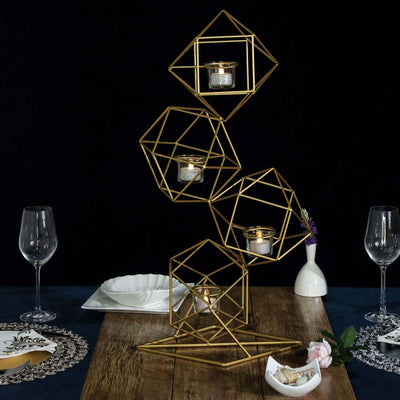 Geometric gold candle holder with tea lights on a dining table setting.