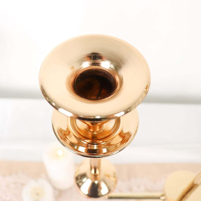 Gold candlestick holder with a sleek design, perfect for elegant decor.