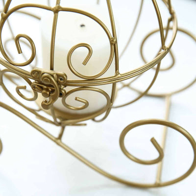 Gold metal candle holder with intricate scrollwork design.