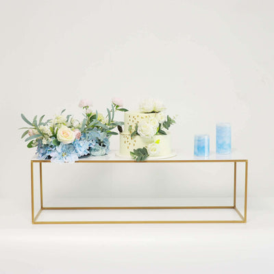 Floral arrangement and candles on a modern table
