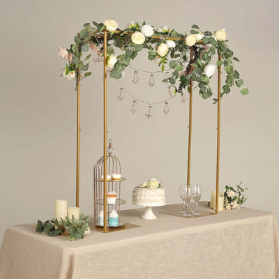 Elegant wedding dessert table with floral decor and a cake stand.