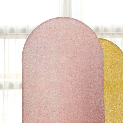Pink and gold glittery backdrop panels in an indoor setting.
