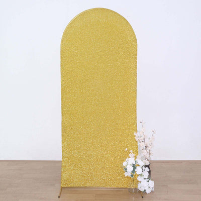 Gold glitter photo backdrop with floral arrangement