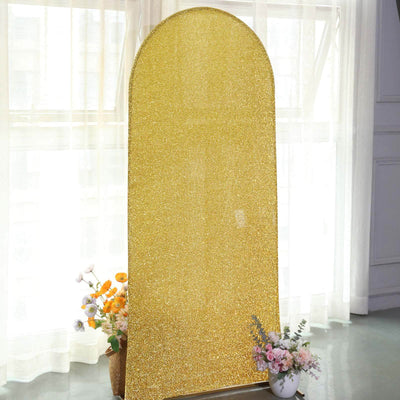 Gold glitter backdrop with an arch shape for photo shoots or events.