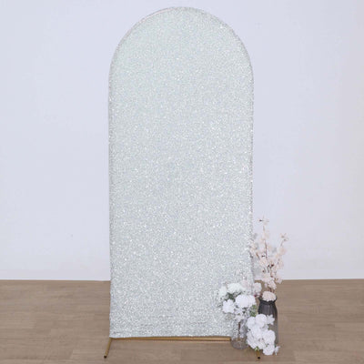 Sparkling arch backdrop with floral arrangement, perfect for events and photos.
