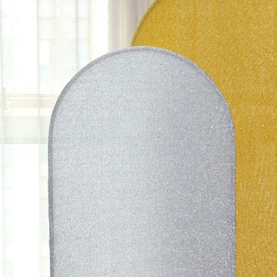 Silver and gold glitter fabric swatches on a light background.