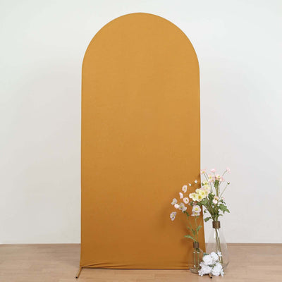 Yellow arch backdrop with flowers in vases for photography.