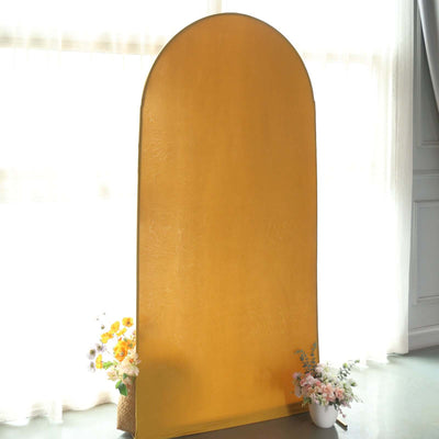 Yellow arch backdrop with floral arrangements on either side.