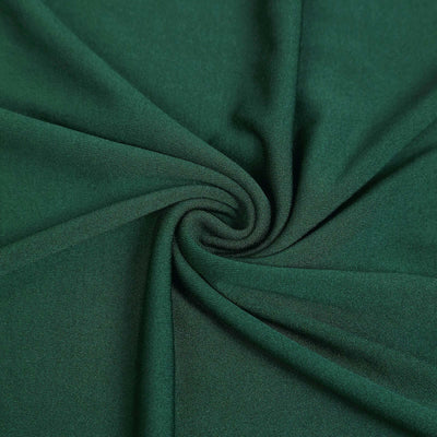 Green fabric with a soft texture and draping quality.