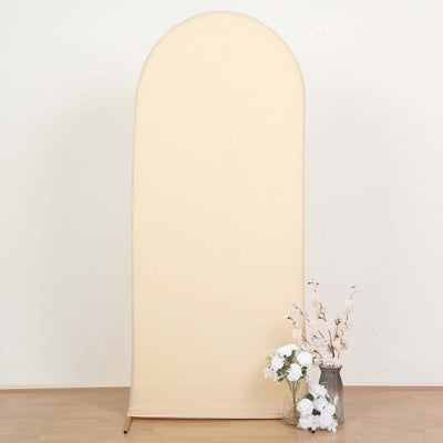 Beige fabric backdrop with floral arrangement in a vase.