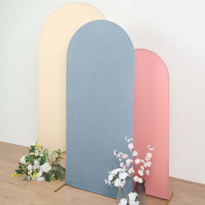 Colorful curved backdrops in pastel shades for photography setups.