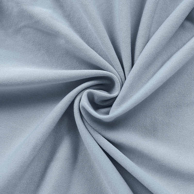 Light blue fabric texture in a swirling pattern.