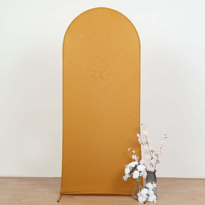 Yellow arch backdrop with flowers in a vase.