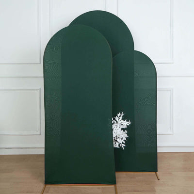 Green decorative room dividers with a floral design on a plain backdrop.