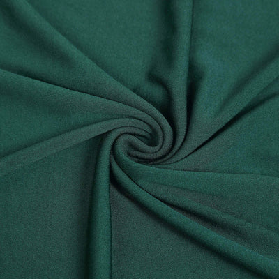 Close-up of soft, green fabric with smooth texture.