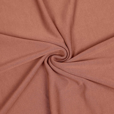 Soft, textured fabric in warm terracotta color, perfect for various sewing projects.
