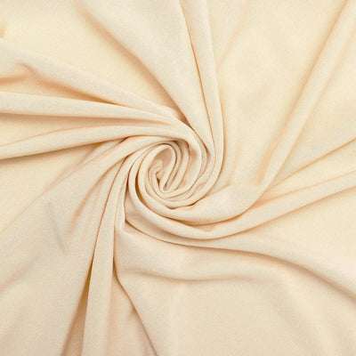Beige fabric with a smooth texture in a spiral arrangement.