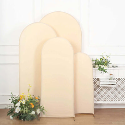 Beige fabric backdrop set with curved tops, ideal for photography.