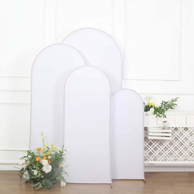 Set of four white backdrop stands for photography, ideal for studio use.