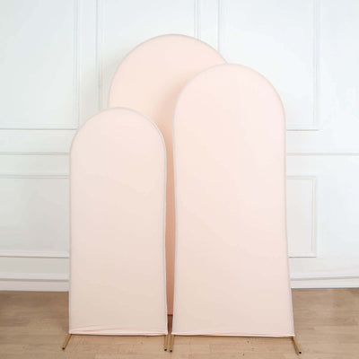 Set of three soft pink fabric backdrops in varying sizes, ideal for photography.