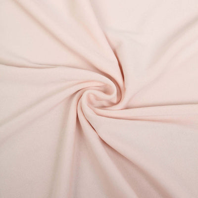 Soft pink fabric swirl texture close-up shot.