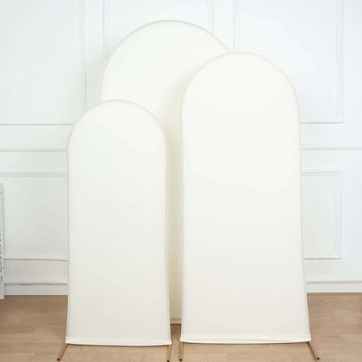 Three white backdrop panels in varying sizes on a plain background.