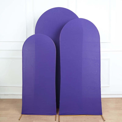 Three purple fabric banners in various heights on a plain background.