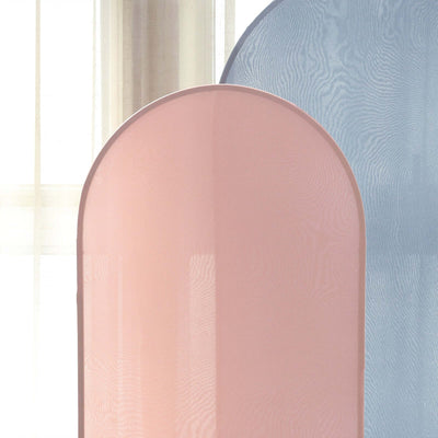 Pink and blue mesh room dividers on a light backdrop